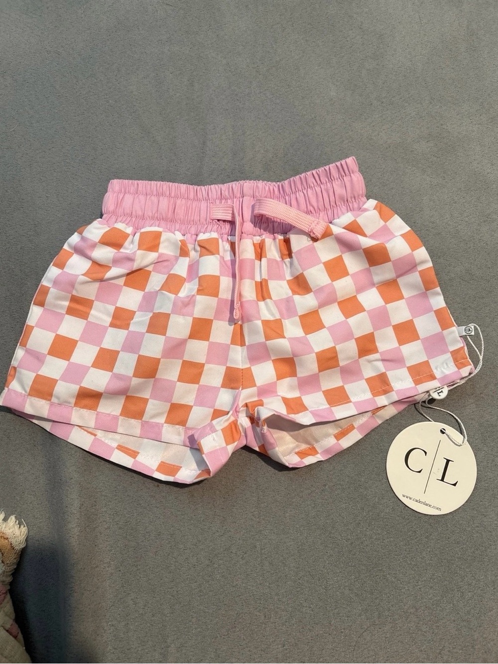 Caden Lane Pink and Orange Checkerboard Kids Swim Trunks
